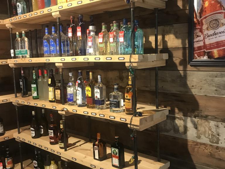 6 shelf wooden shelves ( in liquor store) 70" Long